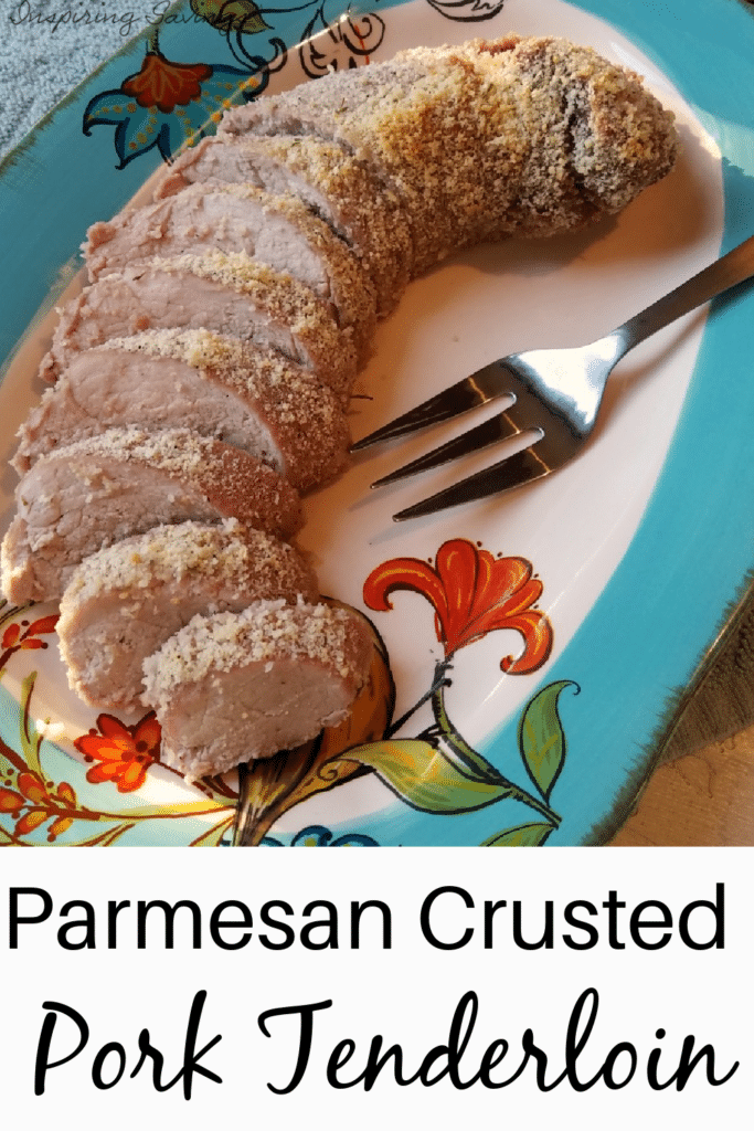 pictured sliced cooked pork tenderloin on blue flower tray with wide metal fork.