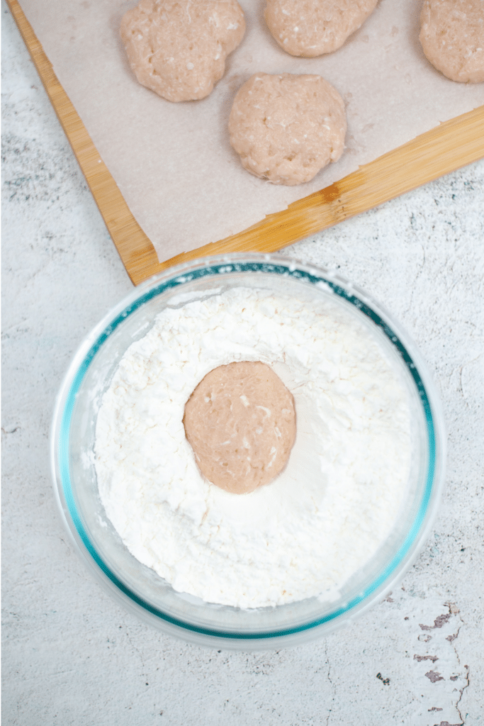 Forming chicken nugget patties on parchment paper