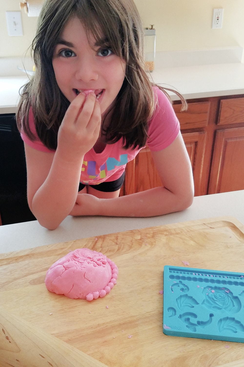 Emily eating Homemade Playdough