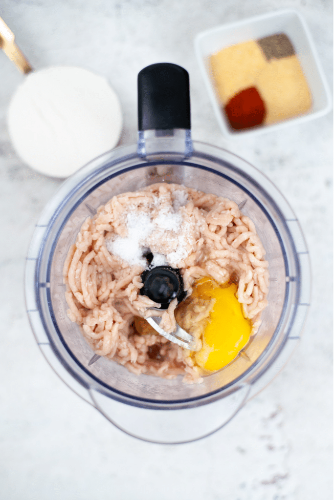 Putting ingredients into the blender chicken nuggets