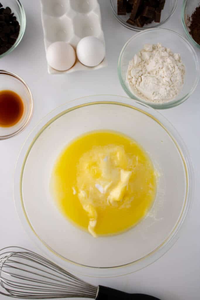 Melted butter in glass bowl with whisk