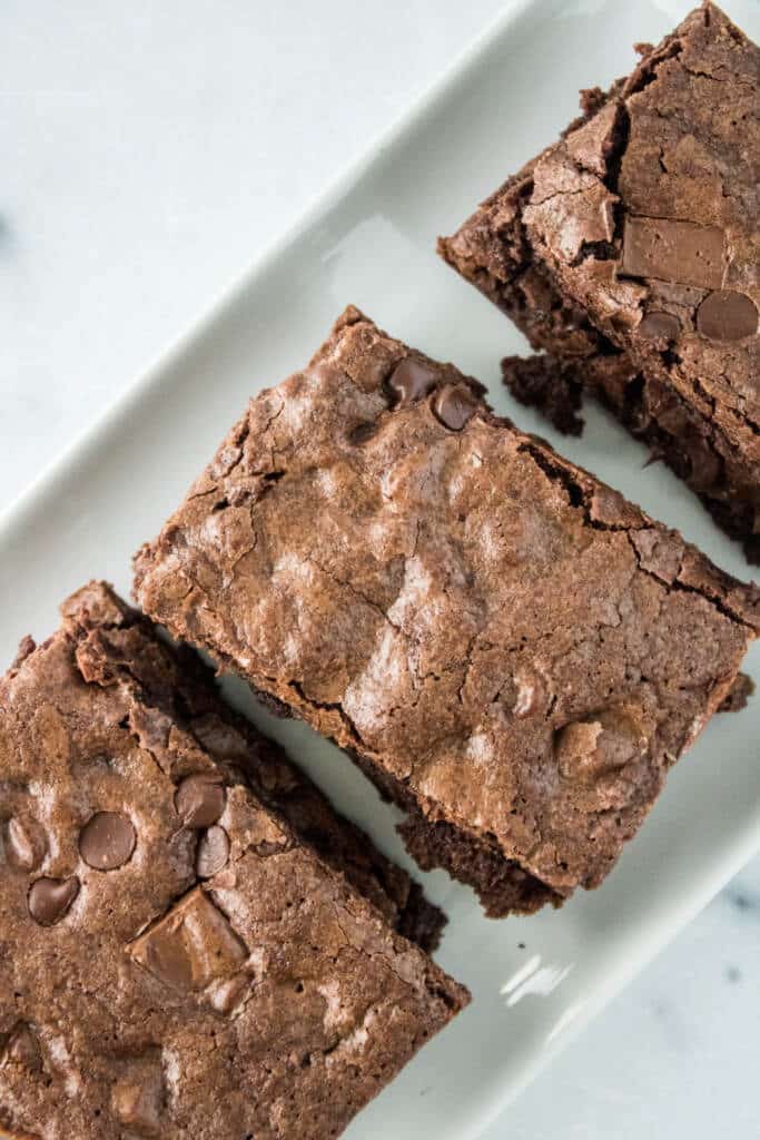 Starbucks double chunk brownies on parchment paper and white plate