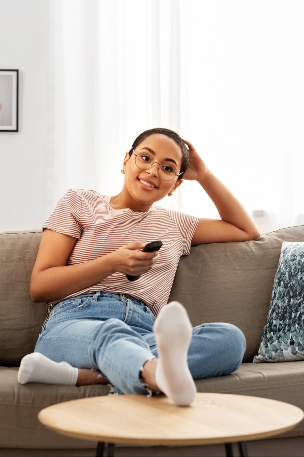 woman with remote control in her hand