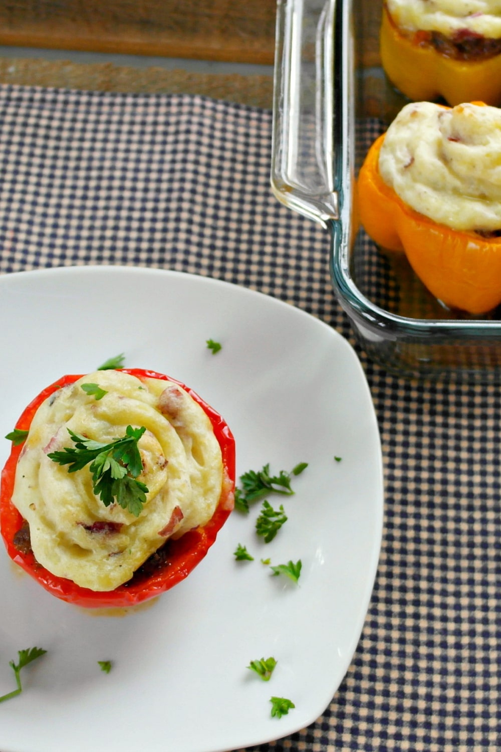 Cooked stuffed peppers Shepards pie - pictured one stuffed pepper on white plate