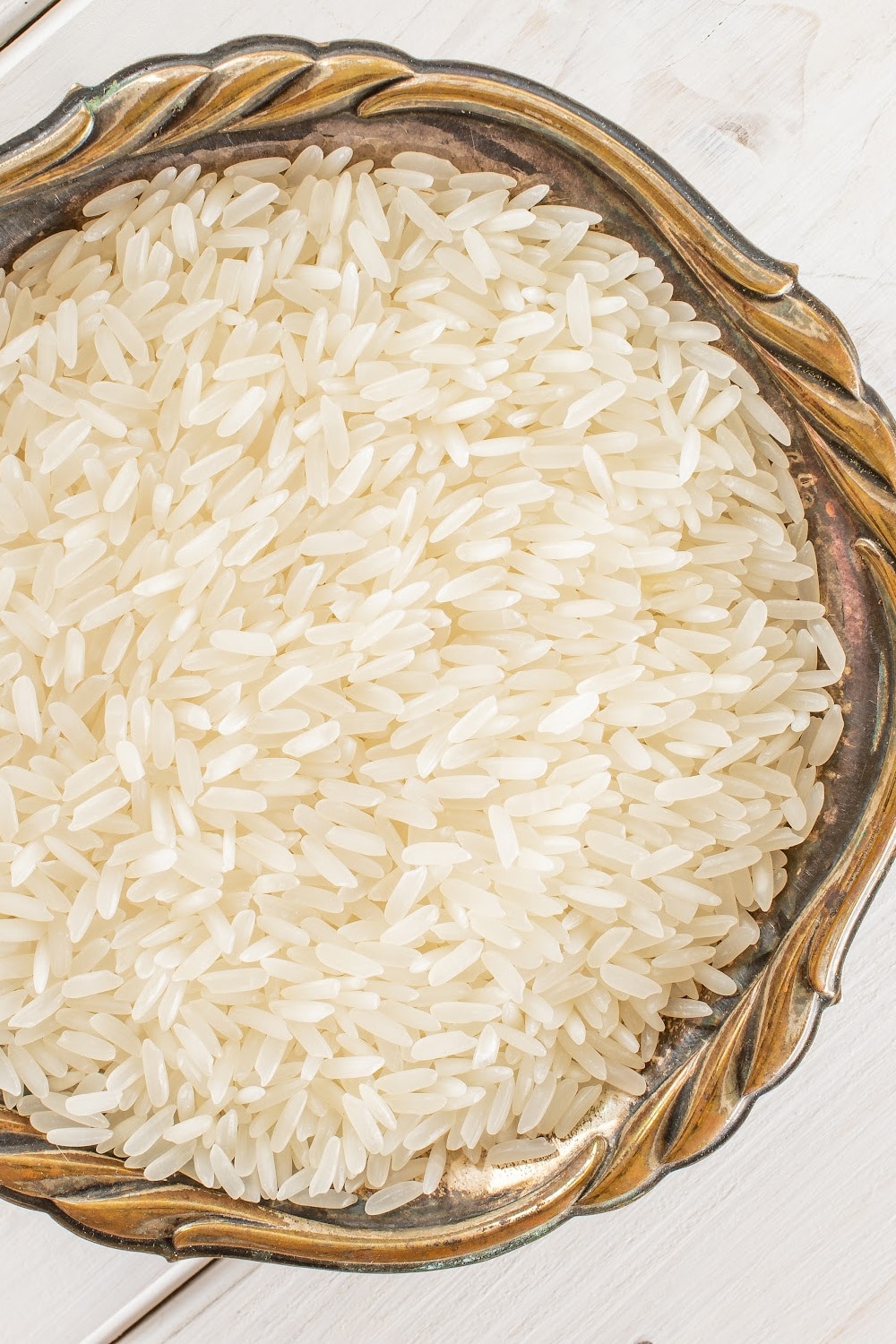 white rice in brown bowl. Rice lasts a very long time