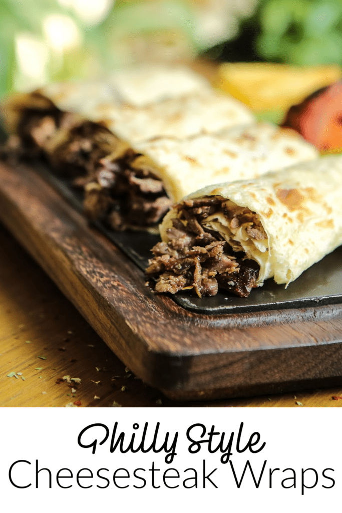 philly cheesesteak wraps on cutting board ready to be served