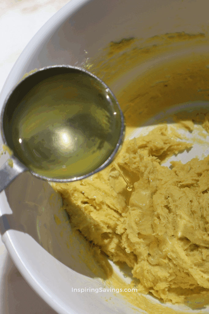 Adding castor oil into shea butter mixture