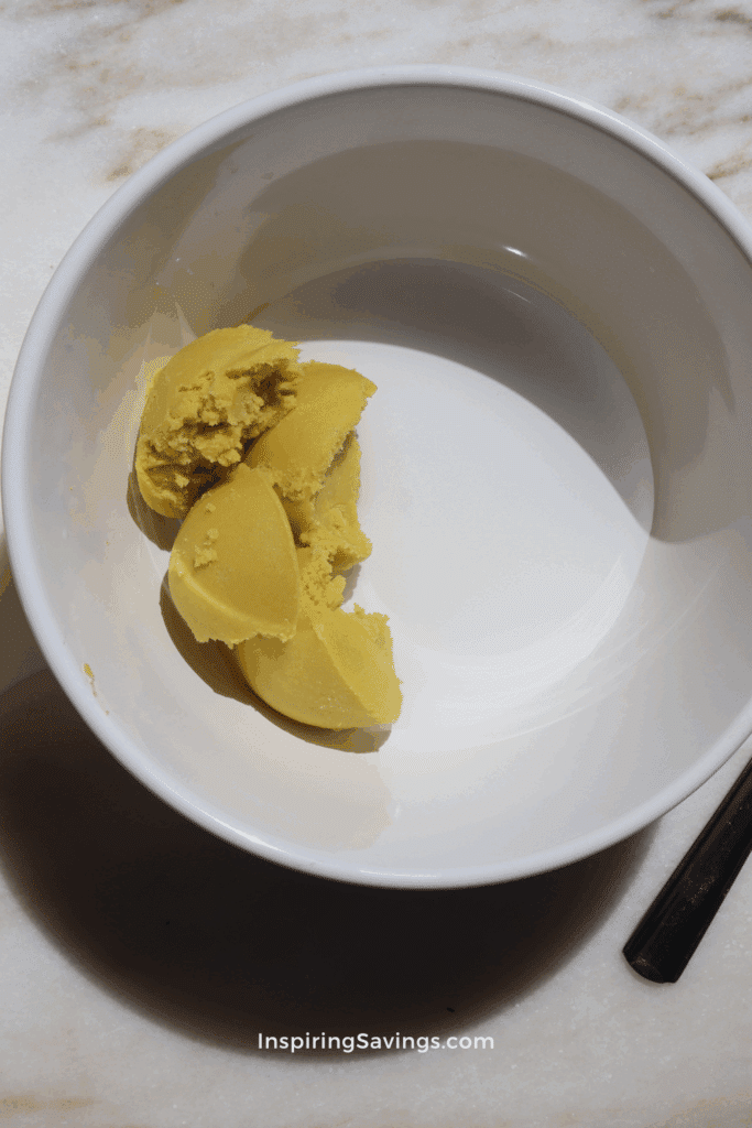 shea butter and water in white bowl